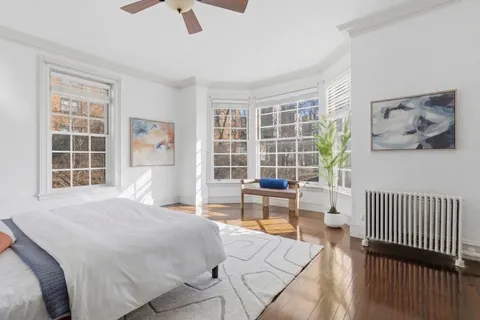 a bedroom with a bed and a table in it