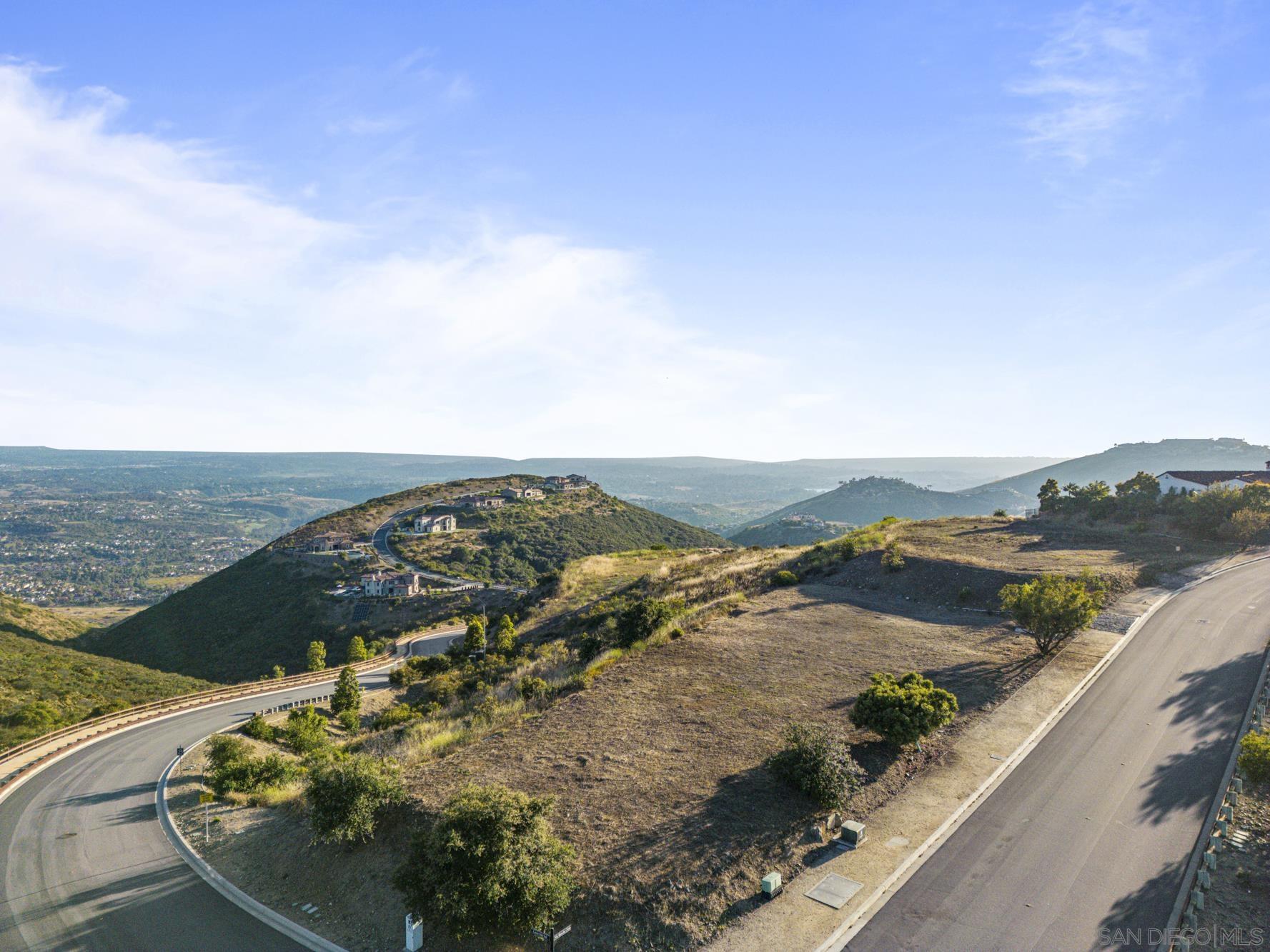 an aerial view of ocean and residential houses