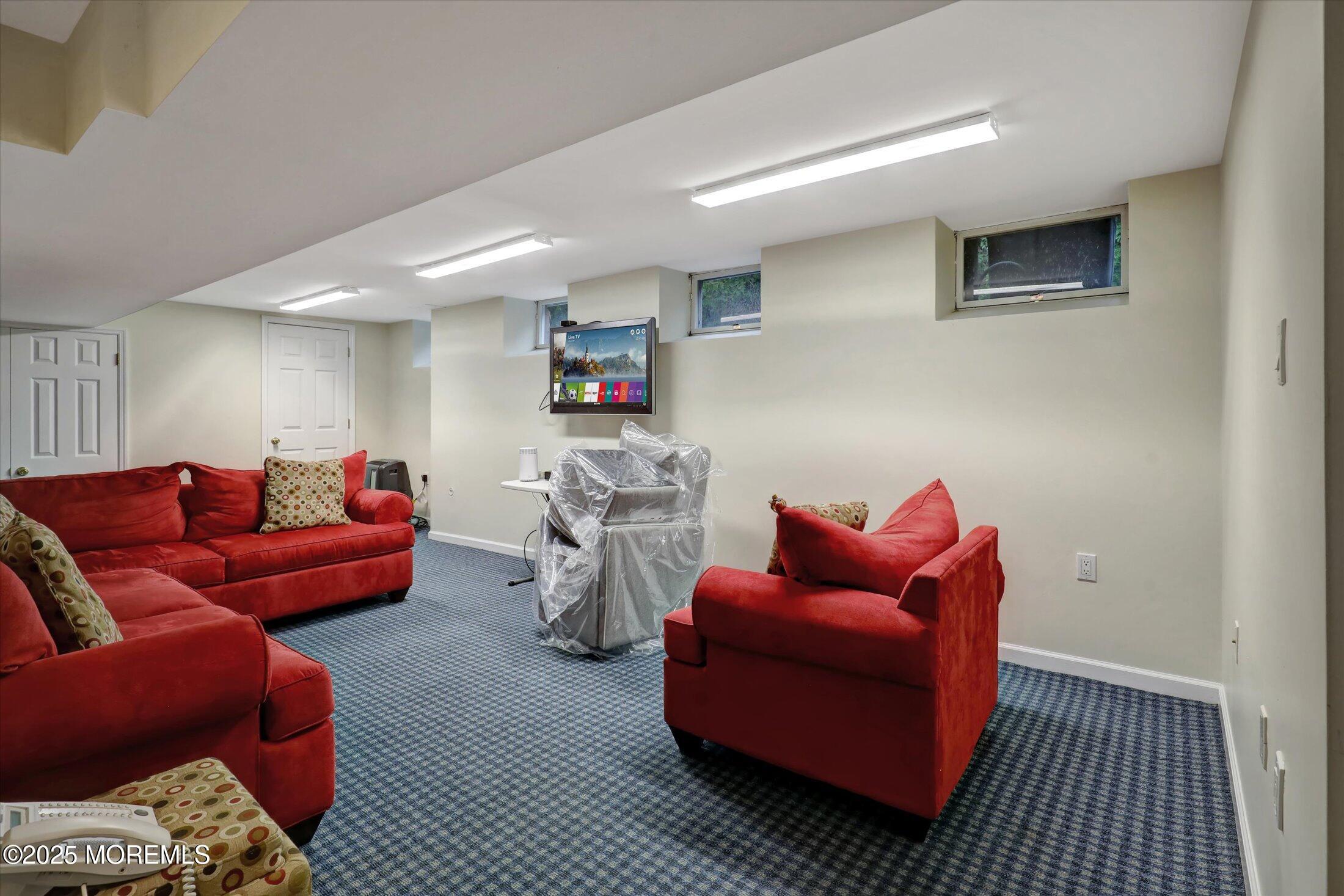 48 Neptune Avenue Deal, NJ 07723 - Photo 13 of 64 a living room with furniture a couch and a window