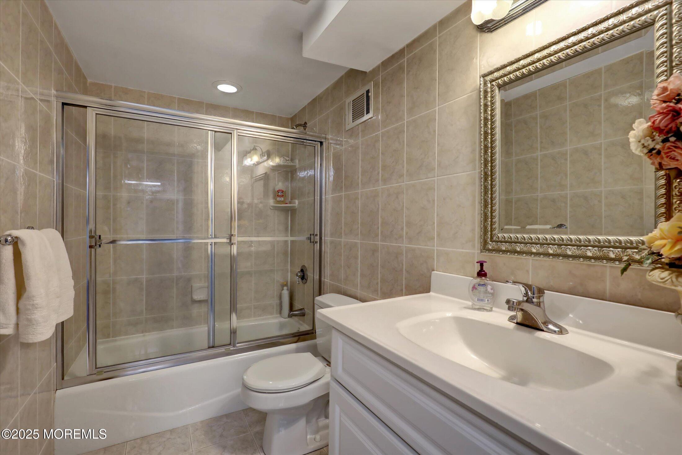 48 Neptune Avenue Deal, NJ 07723 - Photo 14 of 64 a bathroom with a sink toilet and shower