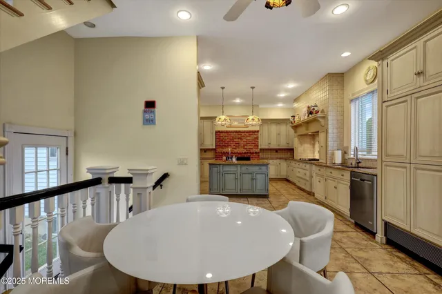 a bedroom with a bed and painting on the wall