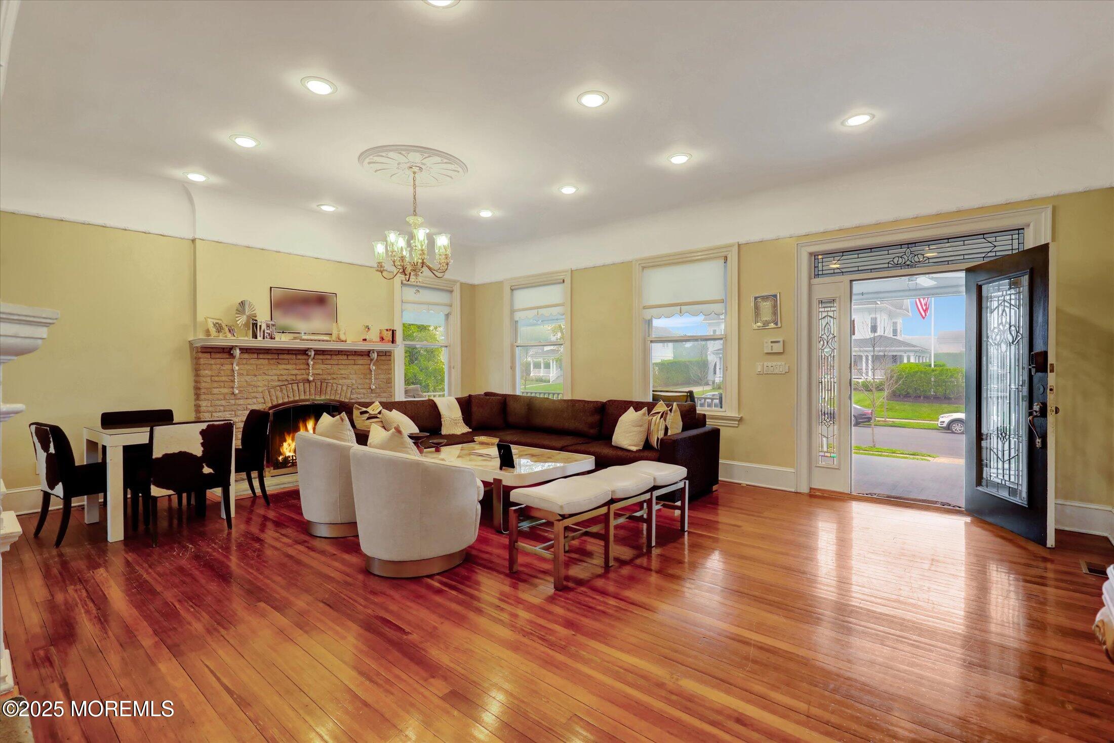 48 Neptune Avenue Deal, NJ 07723 - Photo 25 of 64 a living room with fireplace furniture and a wooden floor