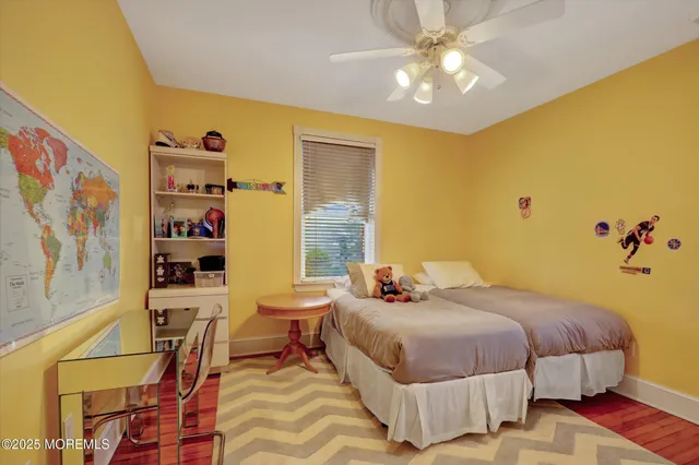 a bed room with a bed and a chandelier