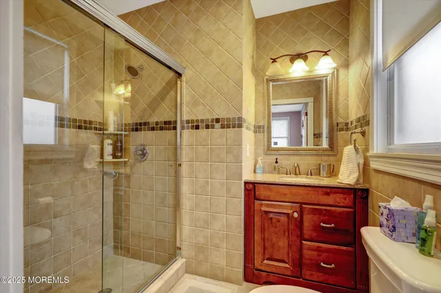 a bathroom with a window and a shower