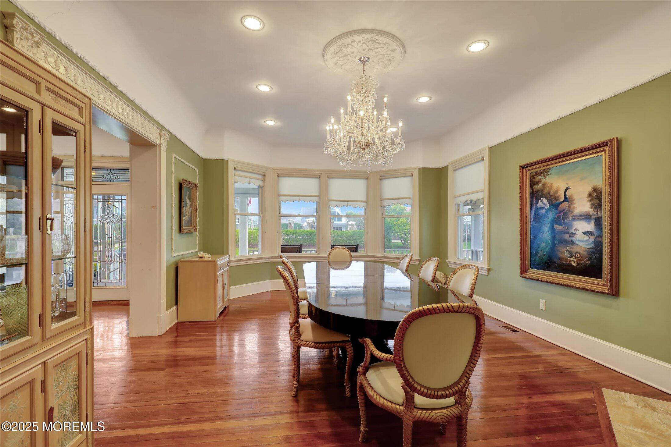 48 Neptune Avenue Deal, NJ 07723 - Photo 32 of 64 a view of a dining room with furniture wooden floor and chandelier