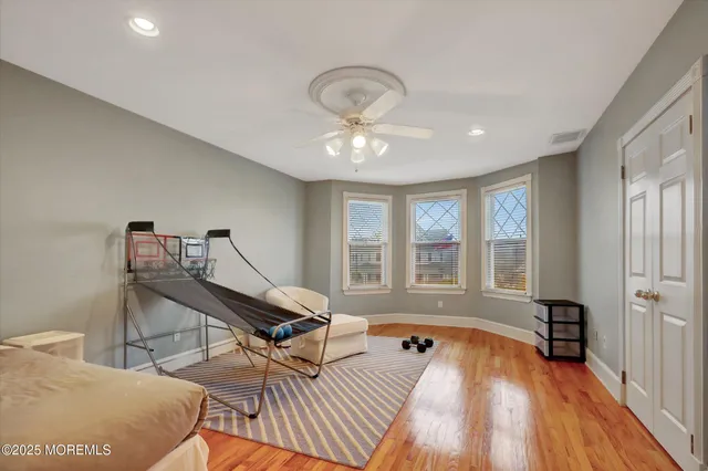 a living room with furniture a couch and a window