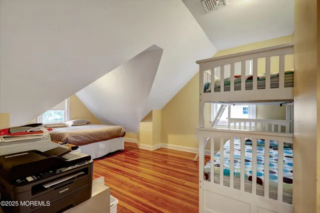 a view of a fountain in front of a house with a big yard