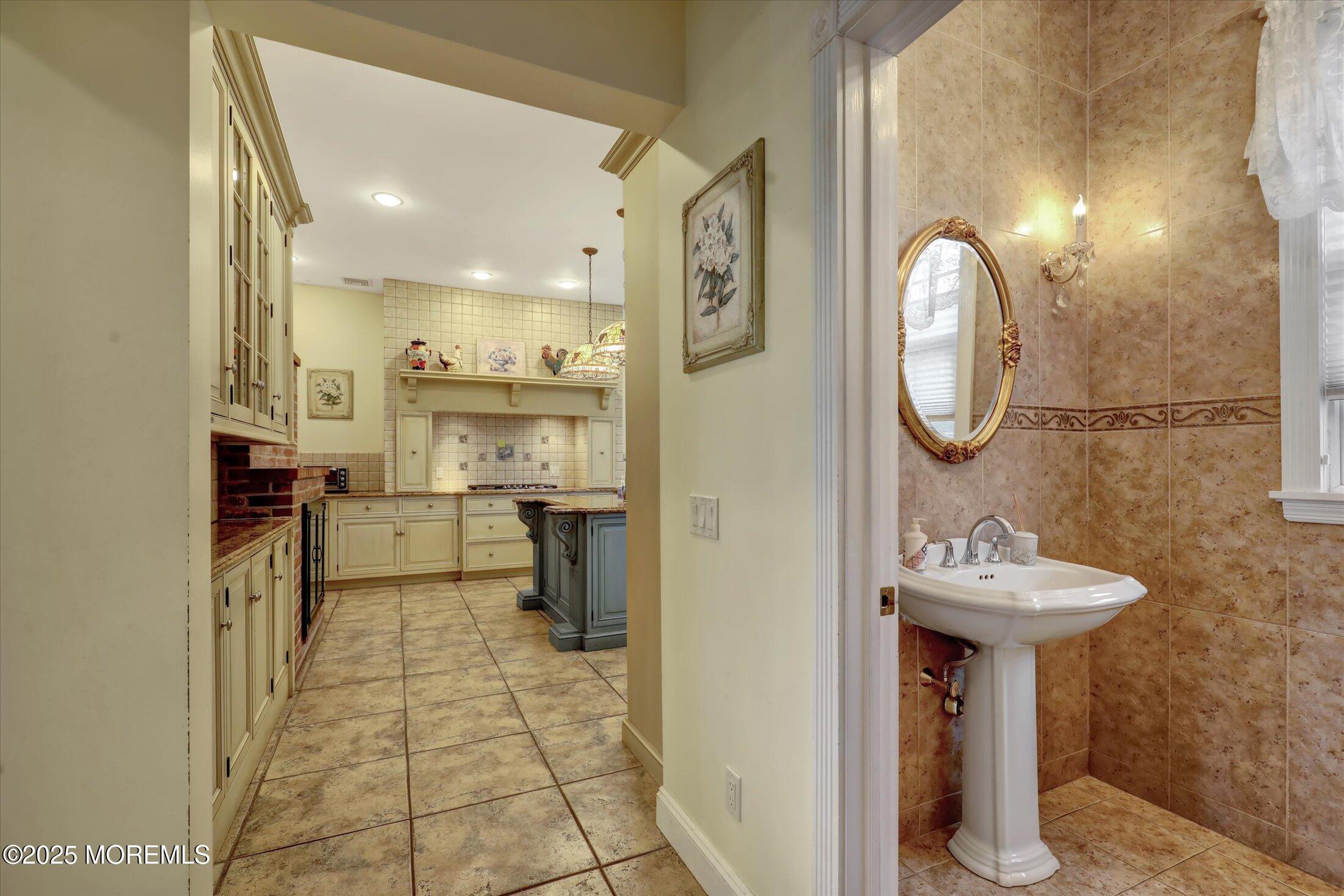 48 Neptune Avenue Deal, NJ 07723 - Photo 41 of 64 a bathroom with a sink mirror and toilet