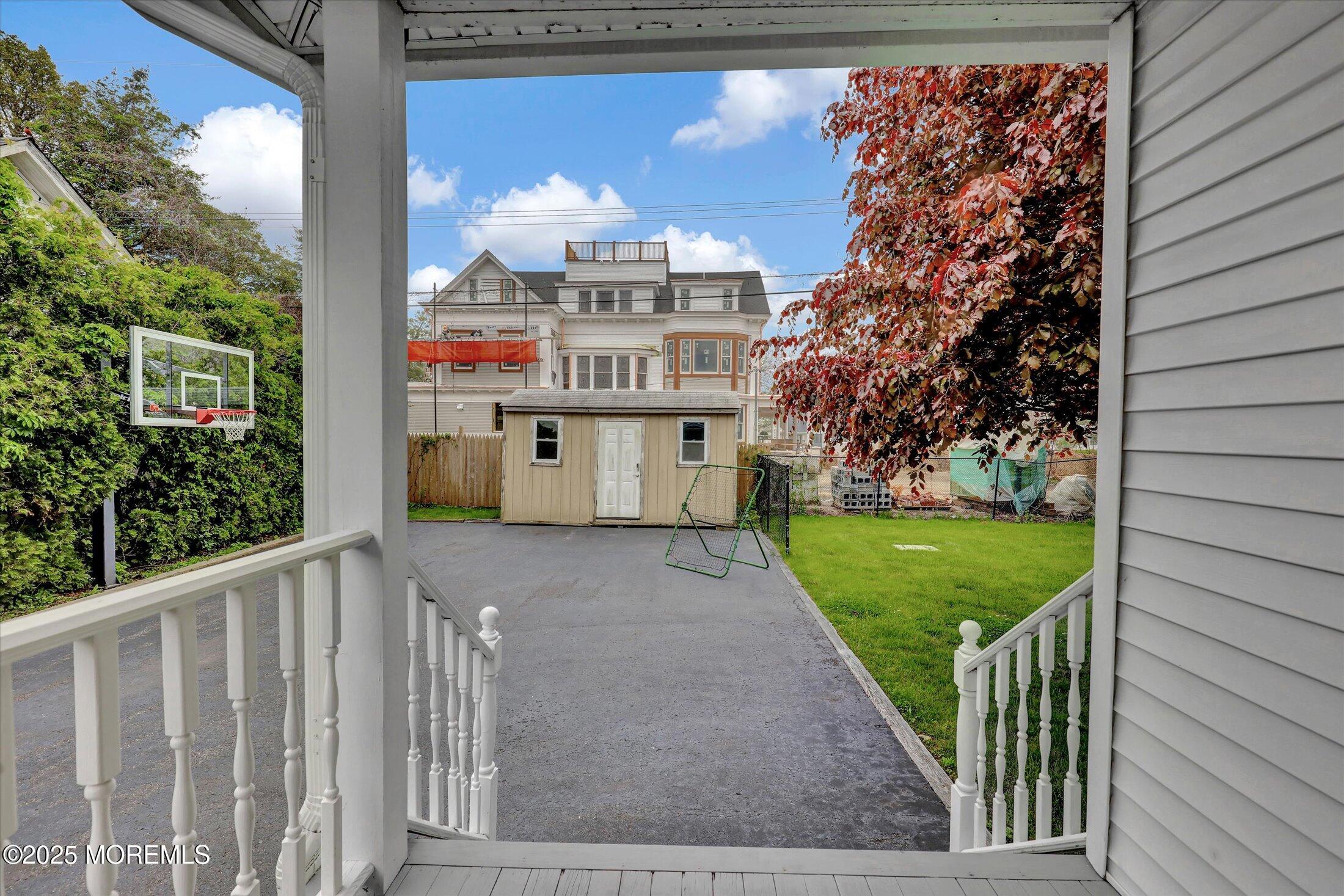 48 Neptune Avenue Deal, NJ 07723 - Photo 46 of 64 a view of a porch with a yard