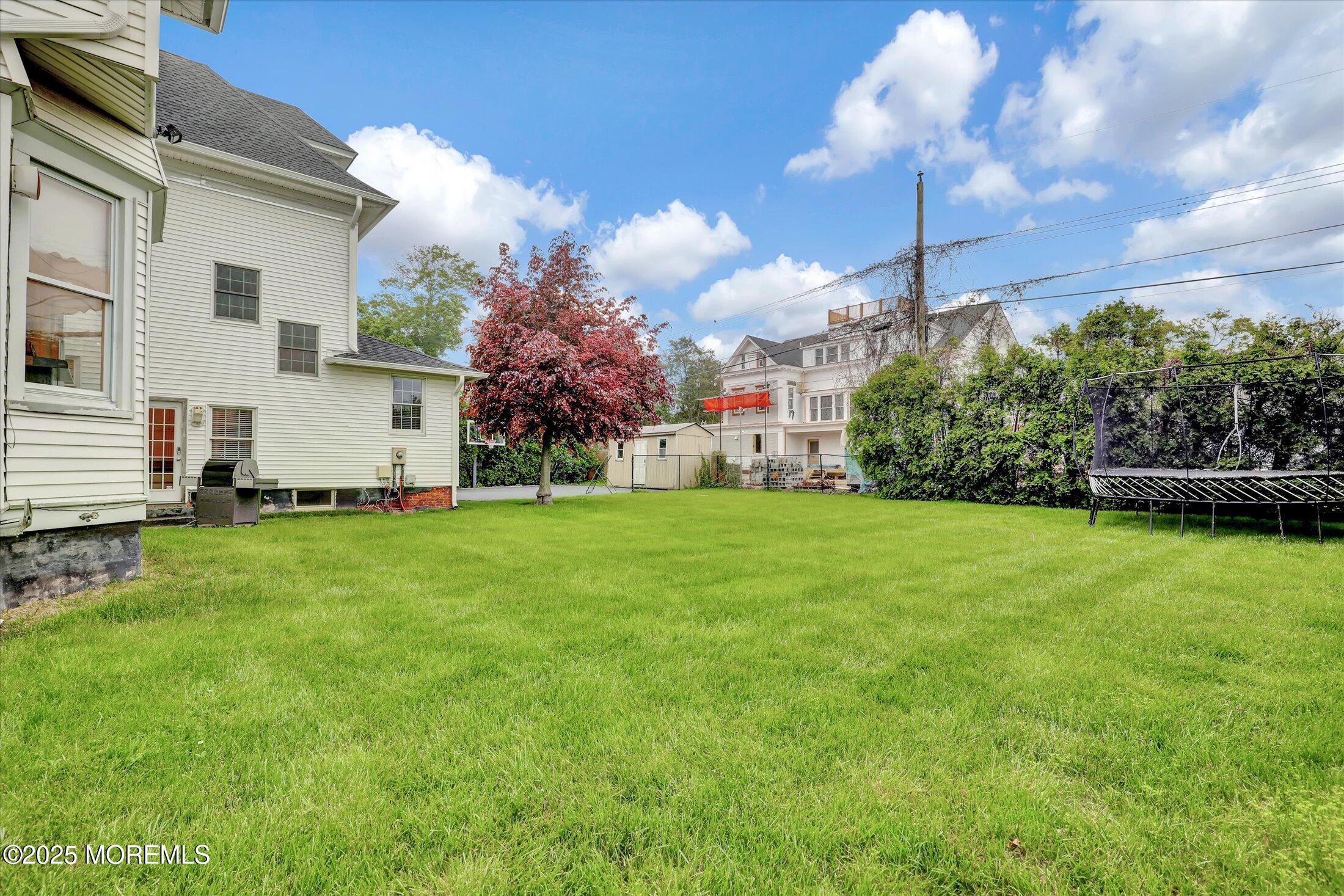 48 Neptune Avenue Deal, NJ 07723 - Photo 49 of 64 a view of a house with a back yard