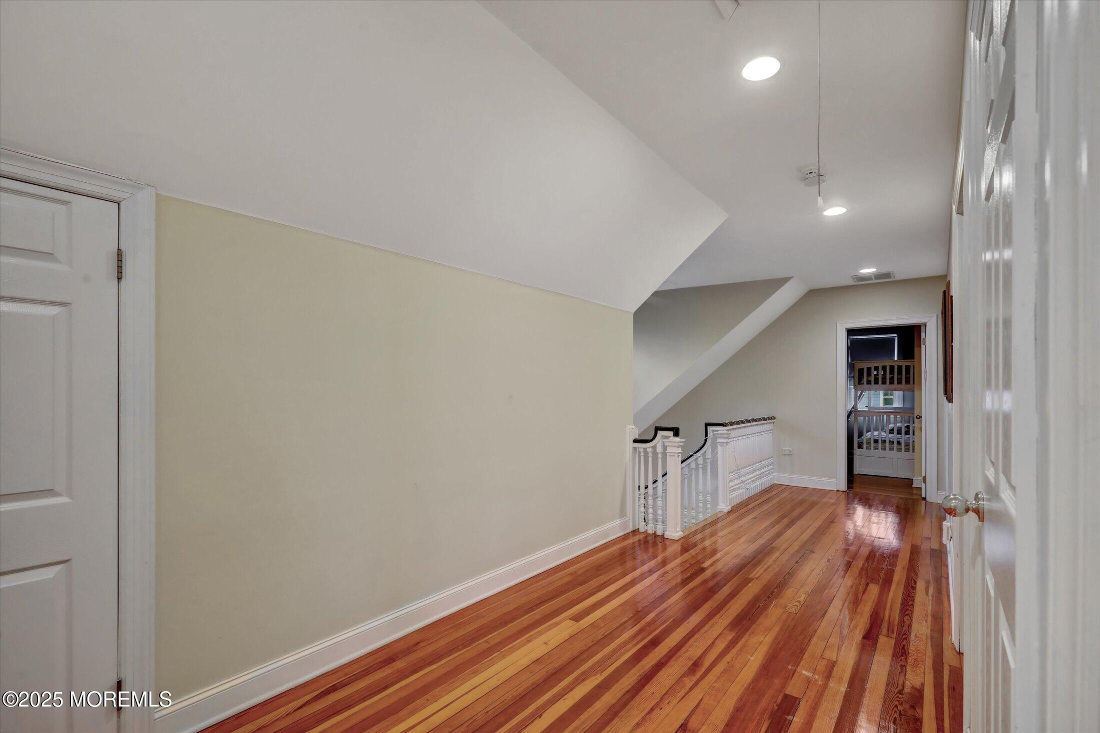 48 Neptune Avenue Deal, NJ 07723 - Photo 7 of 64 a view of empty room with wooden floor