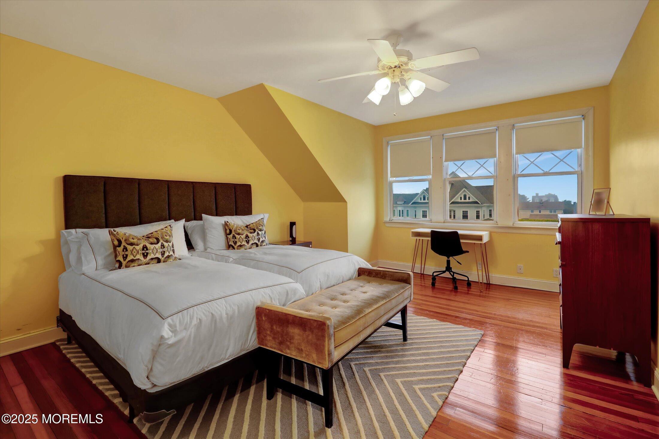 48 Neptune Avenue Deal, NJ 07723 - Photo 8 of 64 a bed room with a bed and a chandelier