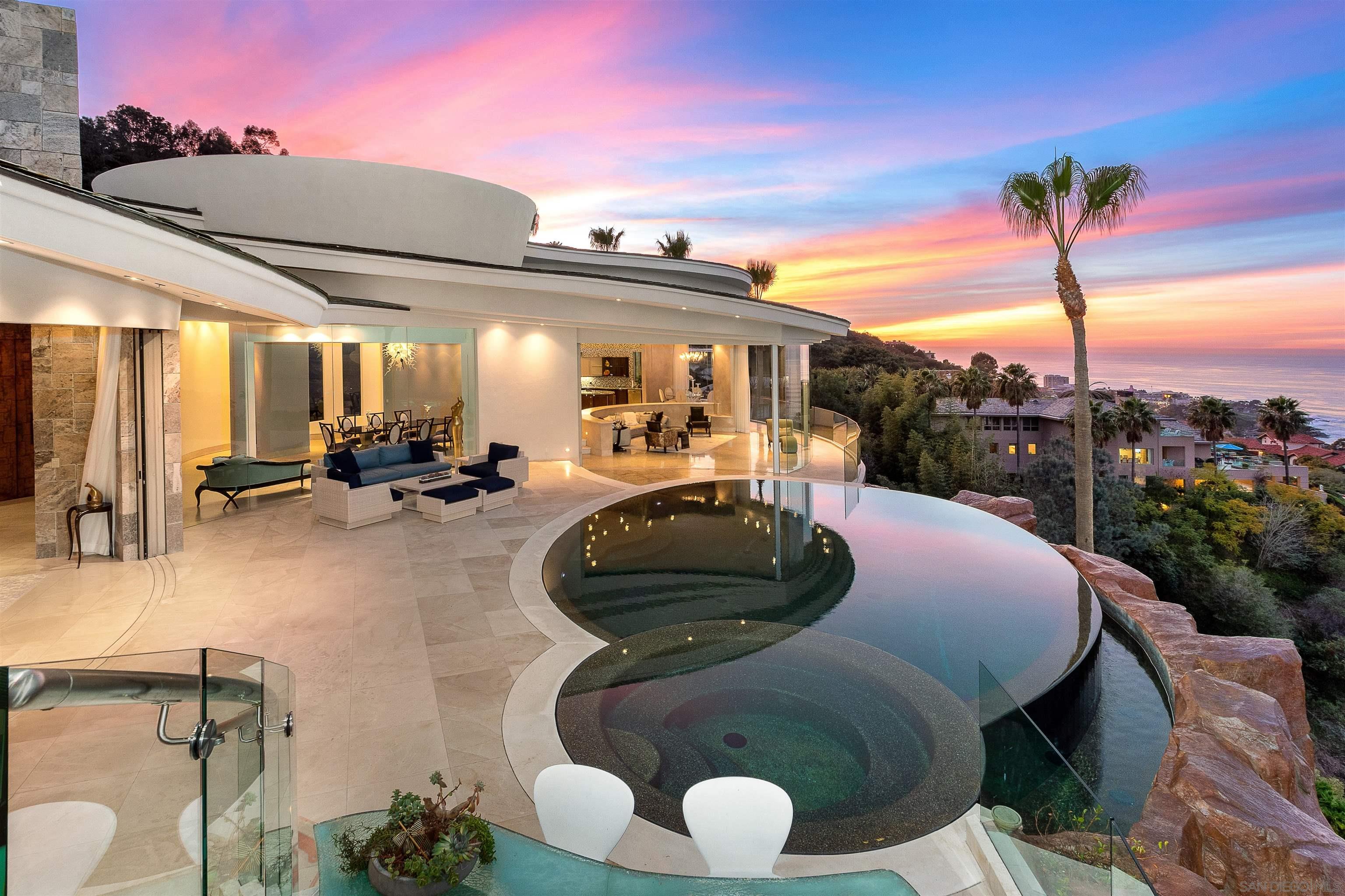 a view of a patio with table and chairs