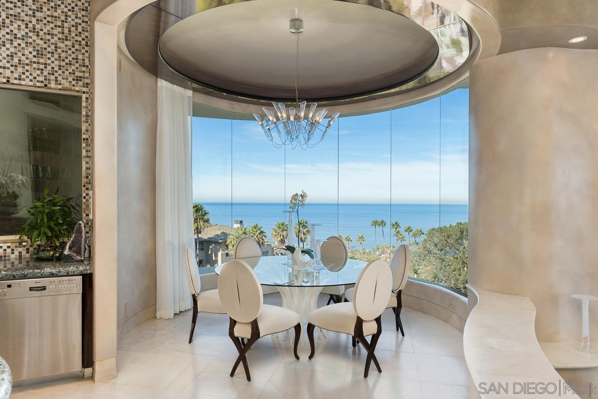 7455 Hillside Drive La Jolla, CA 92037 - Photo 11 of 33 a view of a dining room with furniture and chandelier