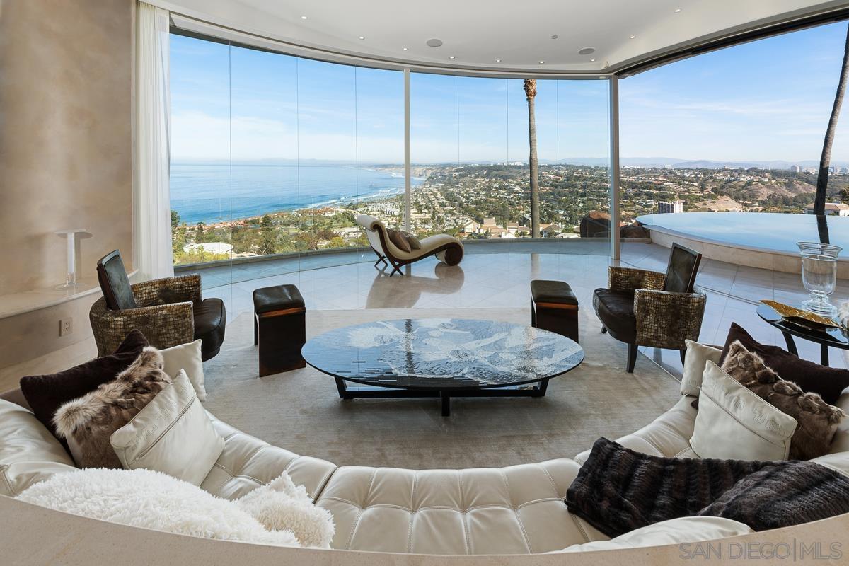 7455 Hillside Drive La Jolla, CA 92037 - Photo 12 of 33 a living room with furniture and a floor to ceiling window