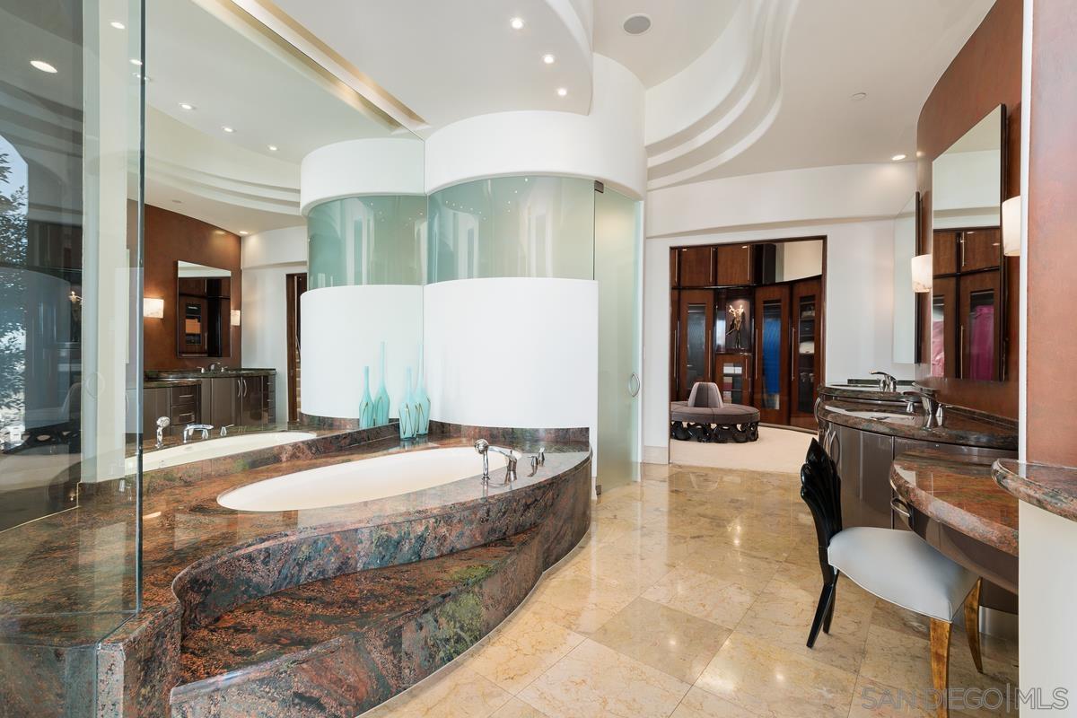 7455 Hillside Drive La Jolla, CA 92037 - Photo 14 of 33 a living room with stainless steel appliances kitchen island granite countertop furniture and a rug