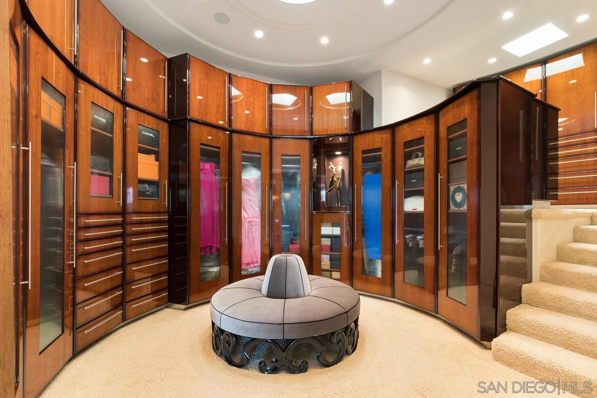 7455 Hillside Drive La Jolla, CA 92037 - Photo 16 of 33 a living room with furniture a lamp and a large window