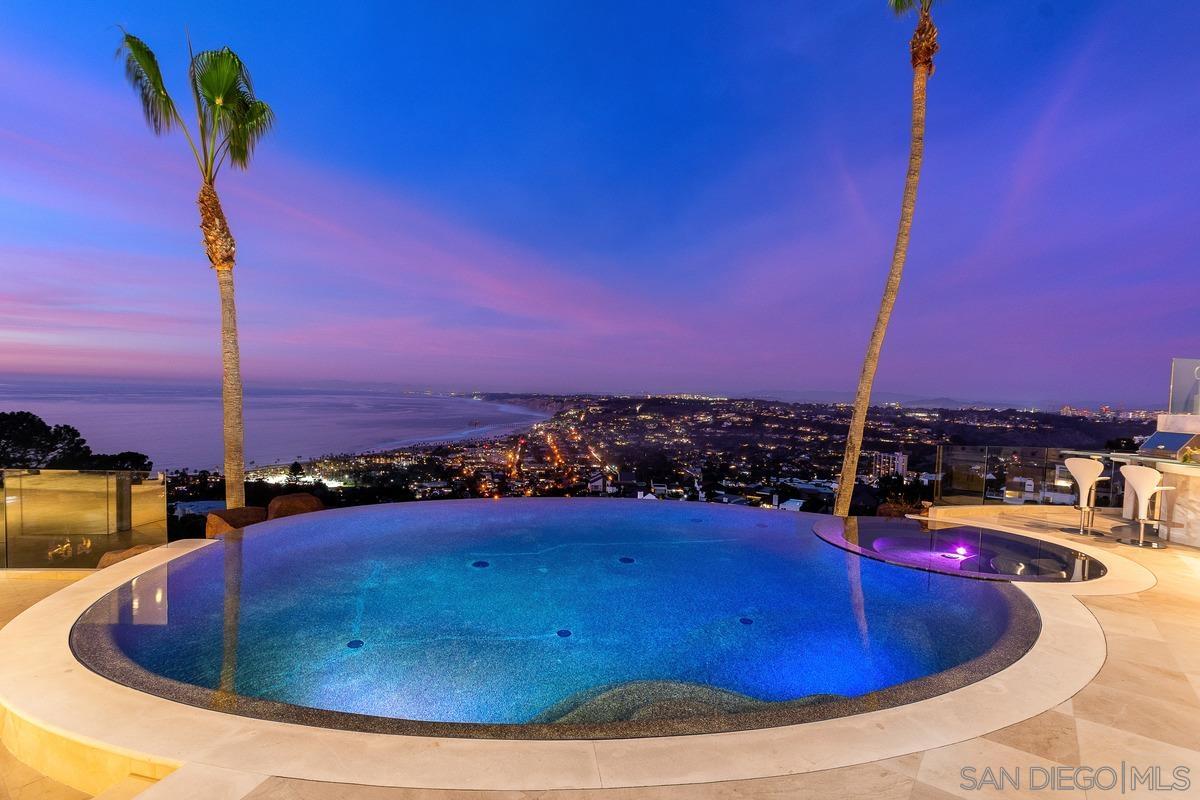 7455 Hillside Drive La Jolla, CA 92037 - Photo 33 of 33 a view of a swimming pool with a table and chairs