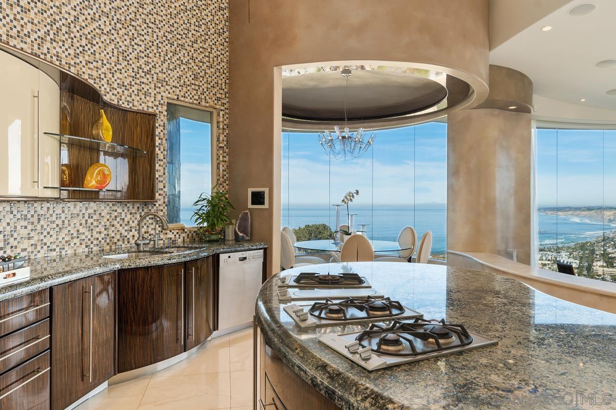 7455 Hillside Drive La Jolla, CA 92037 - Photo 10 of 33 a kitchen with a stove and a sink