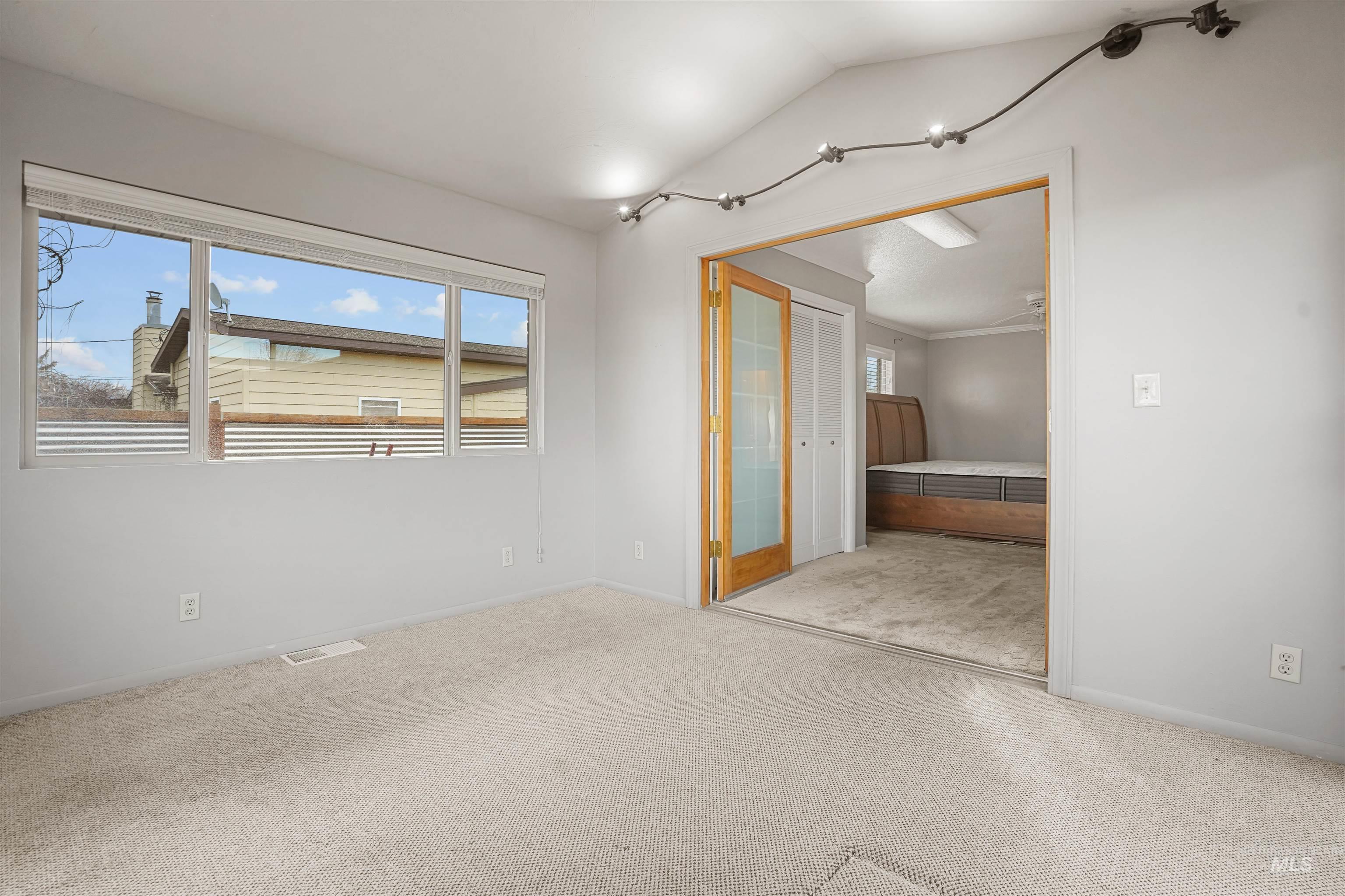 206 Pleasant Way Rupert, ID 83350 - Photo 23 of 33 Unfurnished room featuring light carpet and lofted ceiling