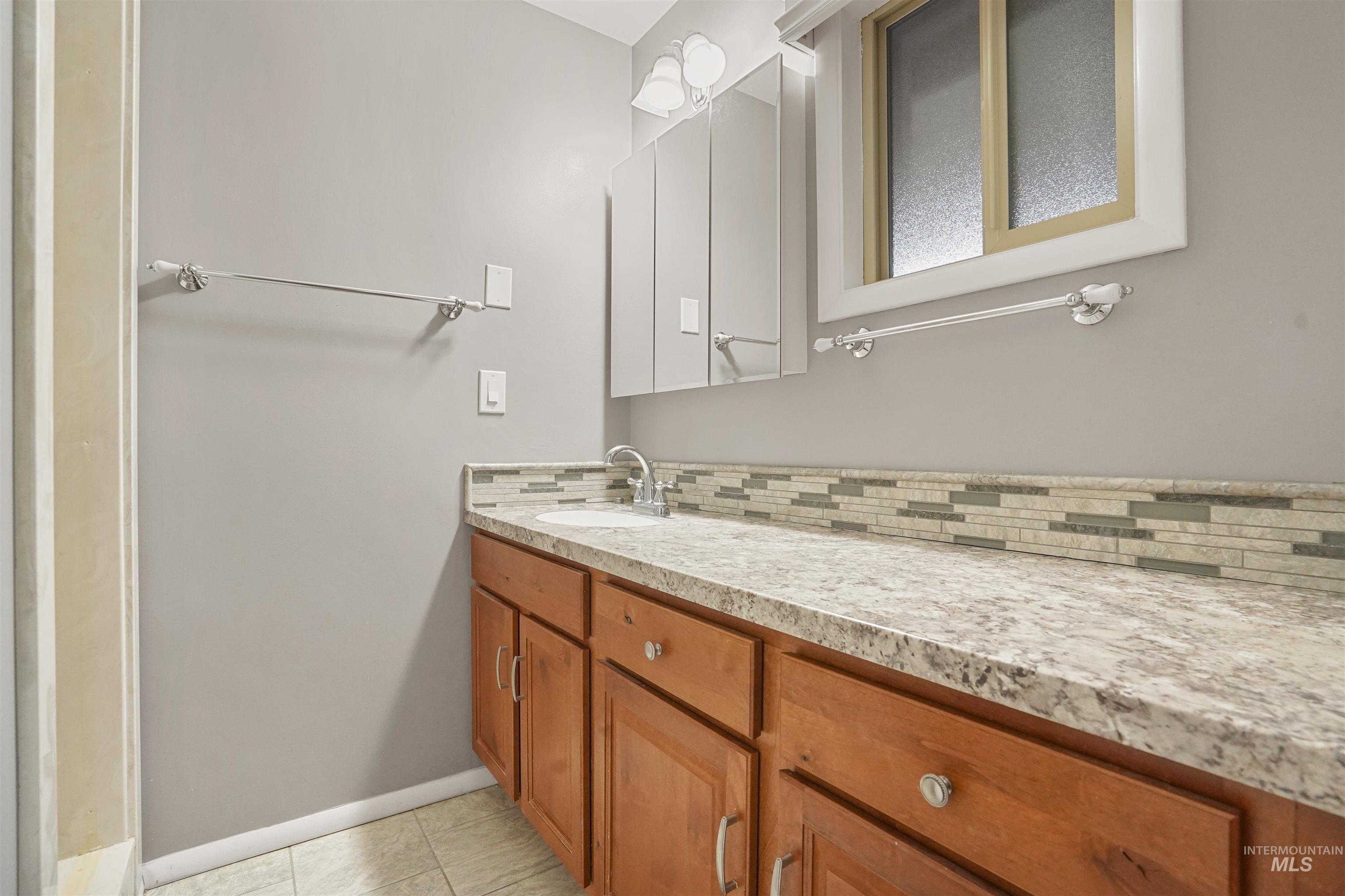 206 Pleasant Way Rupert, ID 83350 - Photo 24 of 33 Bathroom with vanity and light tile patterned floors