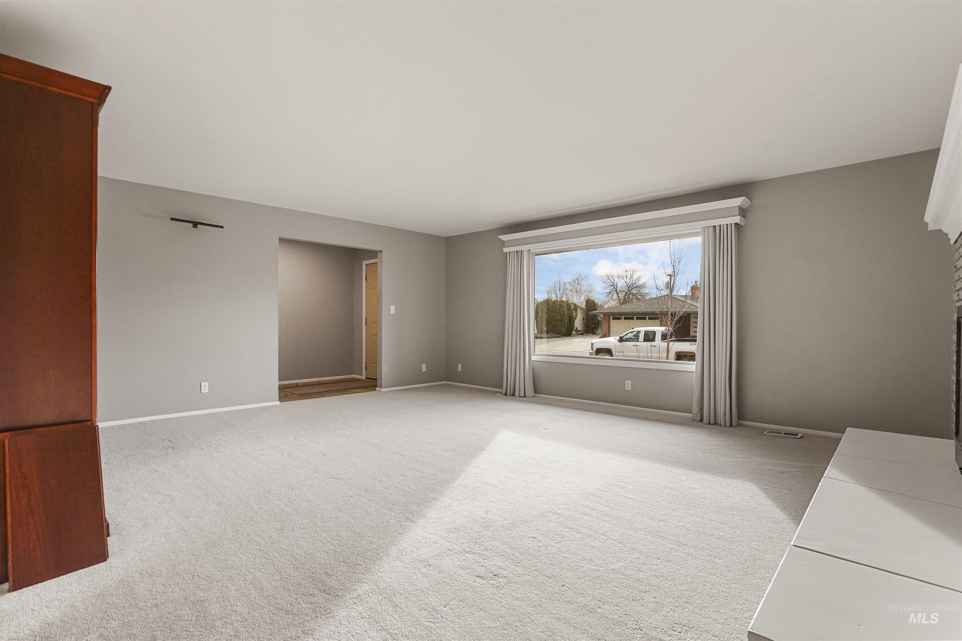 206 Pleasant Way Rupert, ID 83350 - Photo 5 of 33 Spare room featuring light colored carpet and baseboards