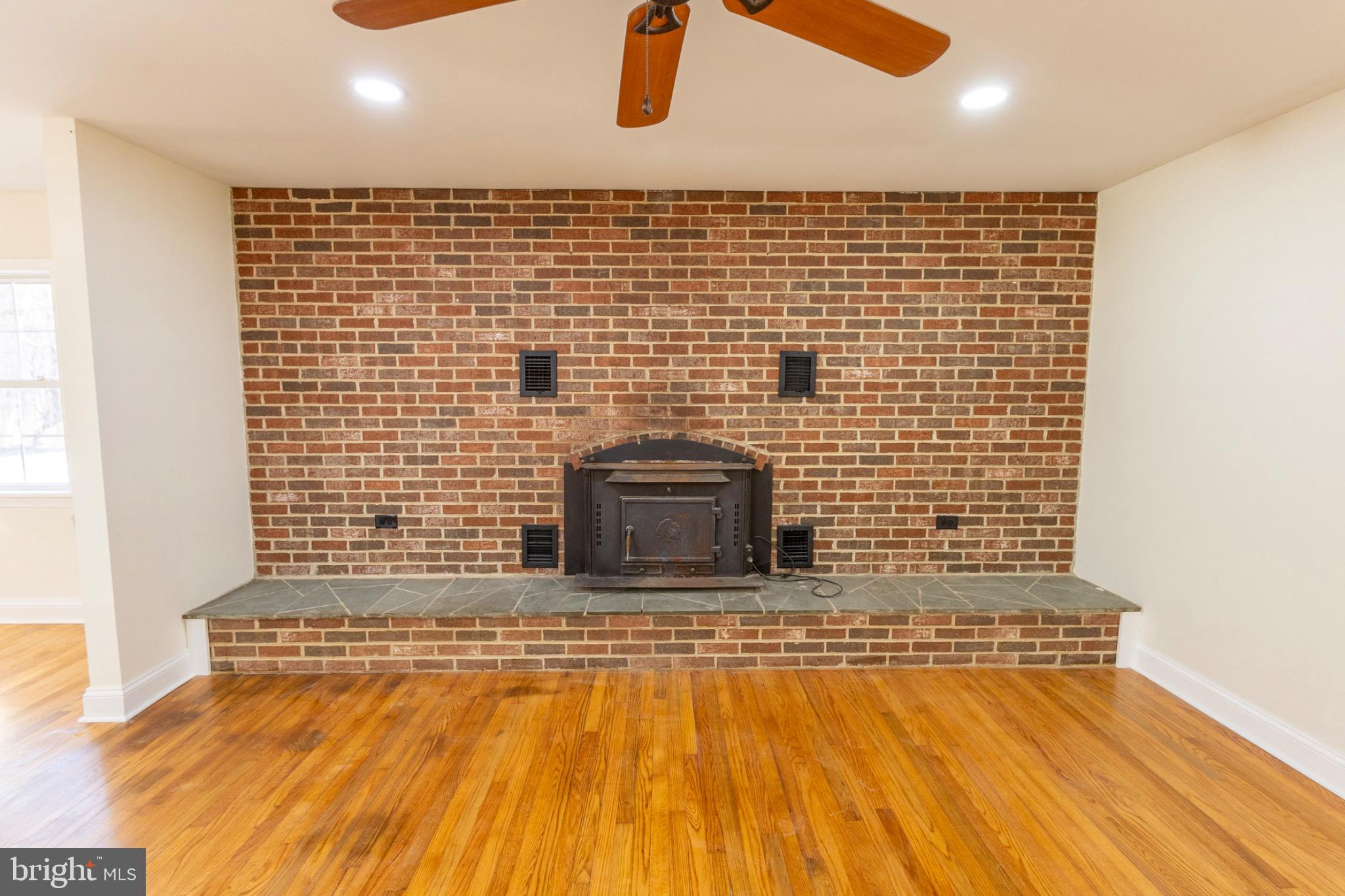 49151 Wynne Road Ridge, MD 20680 - Photo 11 of 80 Cozy brick fireplace.