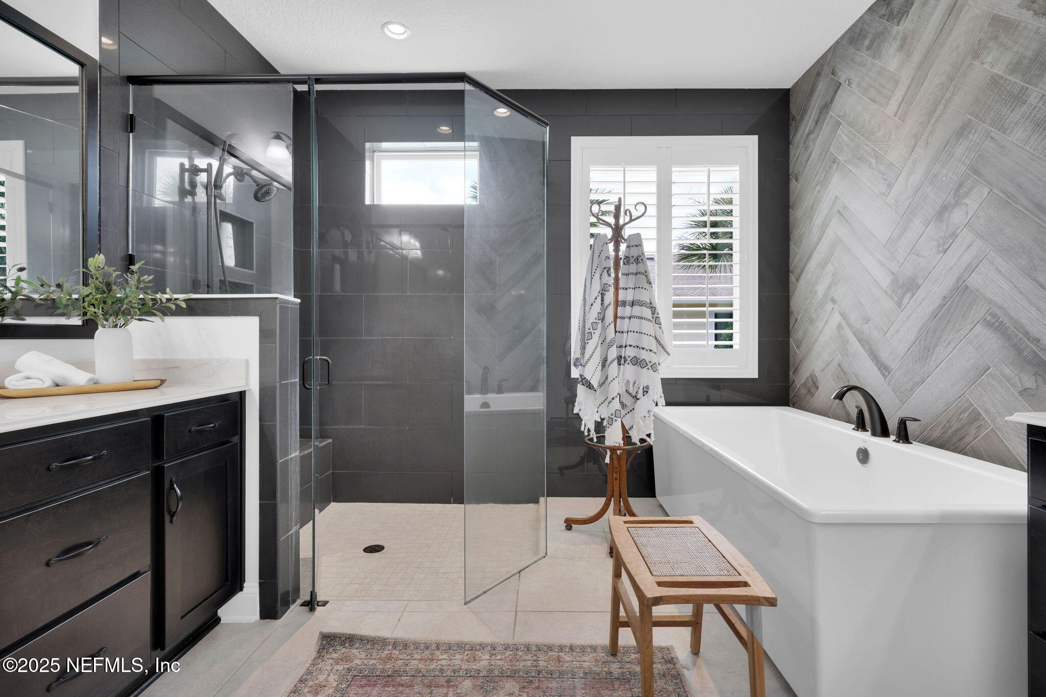 303 Gulfstream Way Ponte Vedra, FL 32081 - Photo 11 of 120 a bathroom with a tub a sink and a large mirror