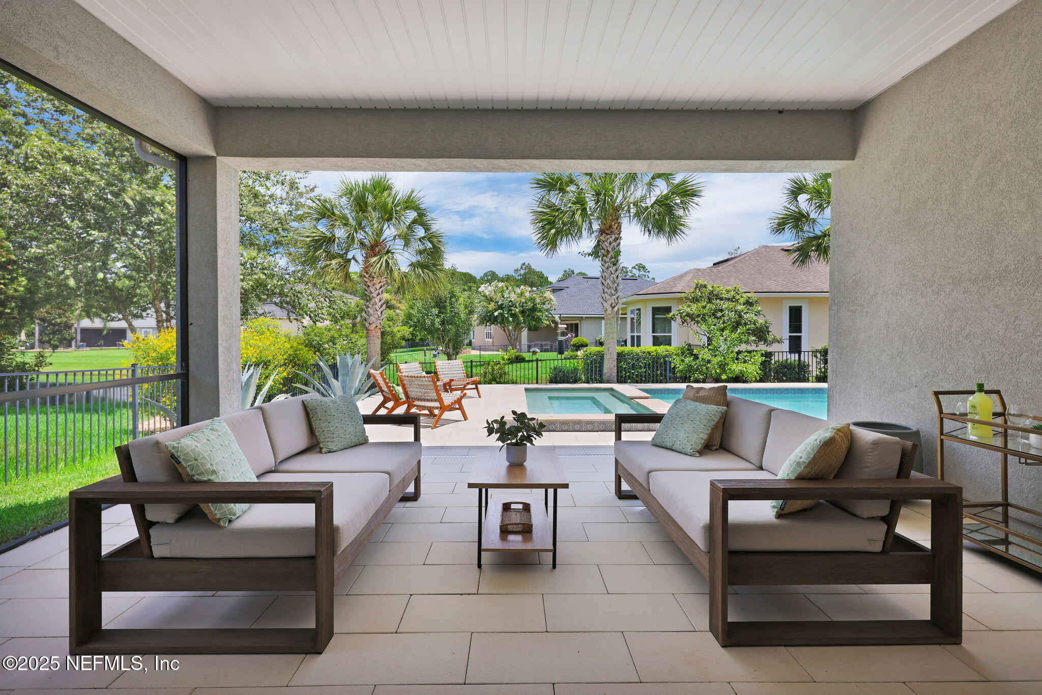 303 Gulfstream Way Ponte Vedra, FL 32081 - Photo 13 of 120 a outdoor living space with furniture and garden view