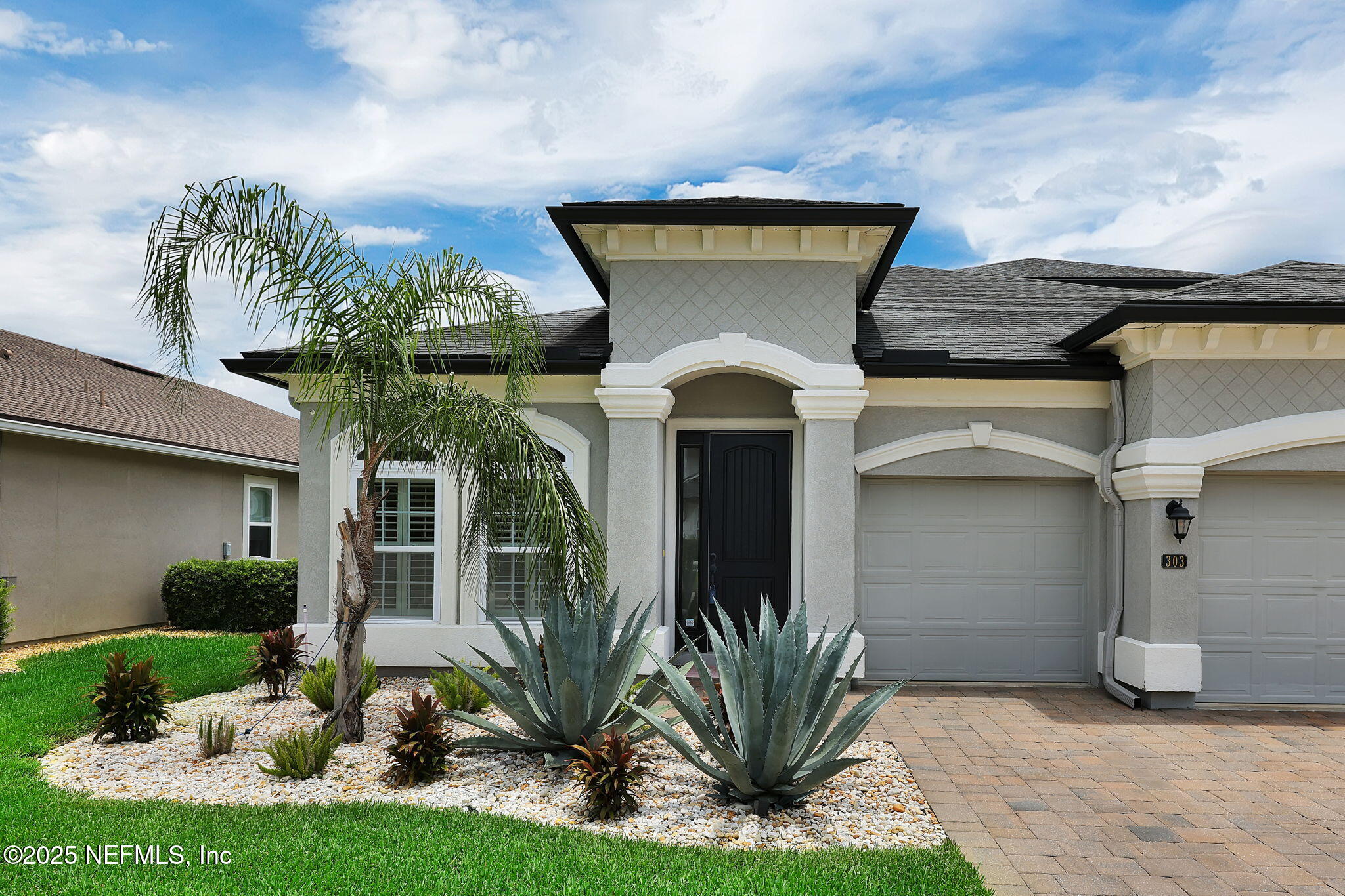 303 Gulfstream Way Ponte Vedra, FL 32081 - Photo 21 of 120 a front view of a house with garden