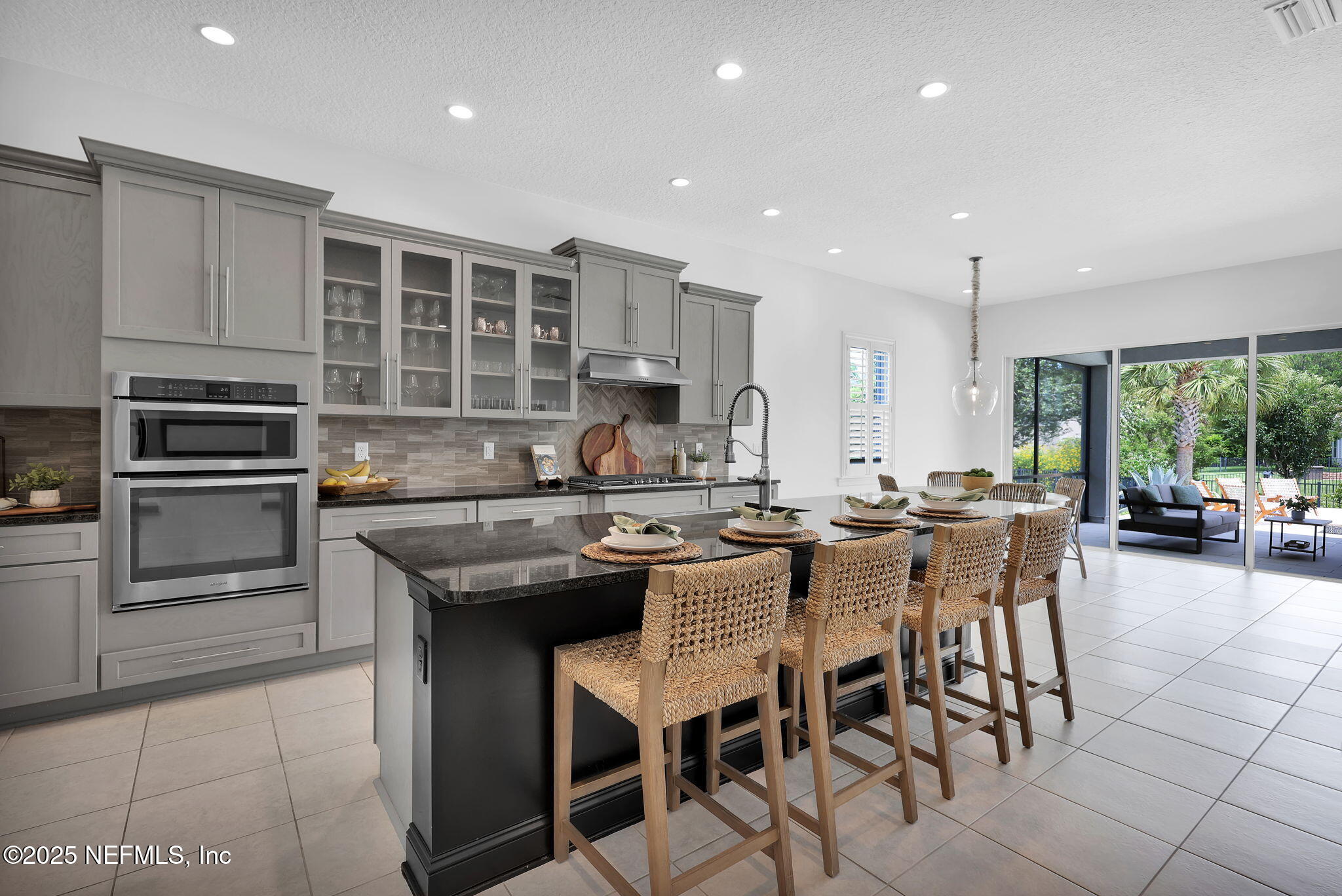 303 Gulfstream Way Ponte Vedra, FL 32081 - Photo 27 of 120 a kitchen with stainless steel appliances granite countertop a stove top oven a sink dishwasher a dining table and chairs