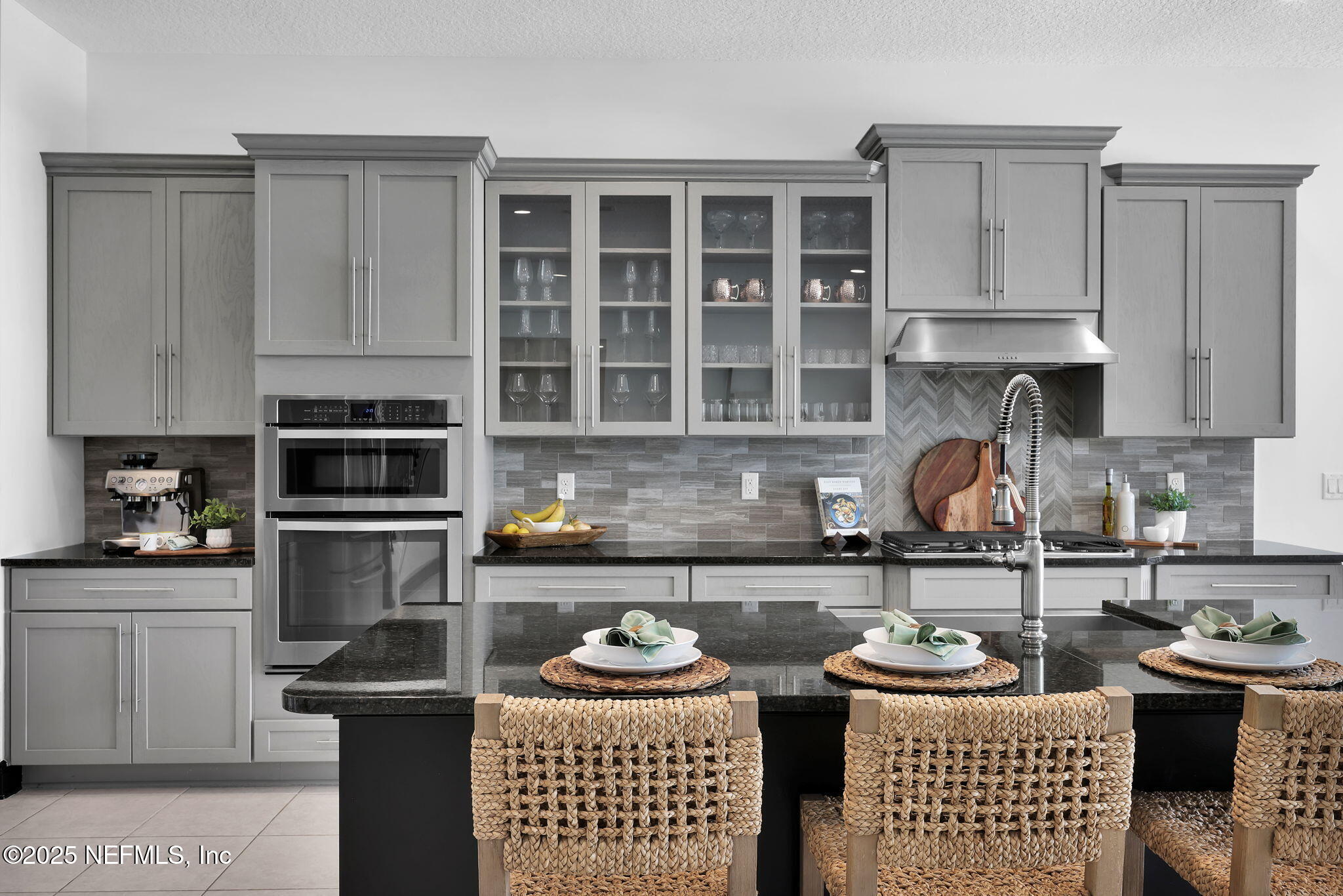 303 Gulfstream Way Ponte Vedra, FL 32081 - Photo 5 of 120 a kitchen with a stove a sink and cabinets
