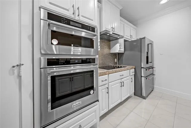 a view of empty room with wooden floor and ceiling fan