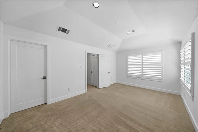 a kitchen with a stove and a refrigerator