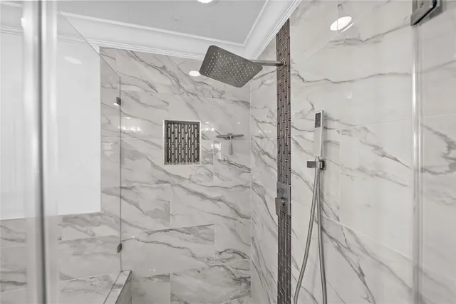 a bathroom with a toilet and shower