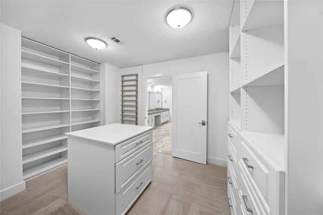 a view of an empty room with a ceiling fan