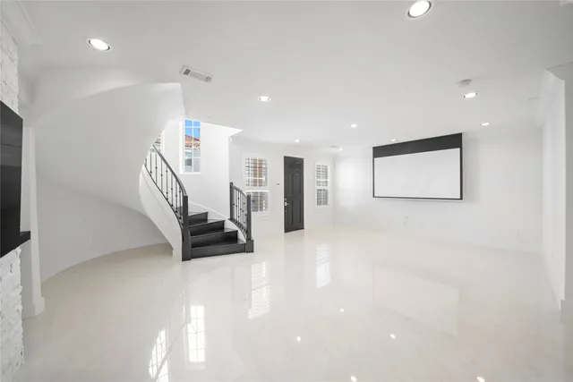 a view of entryway with stairs and a rug