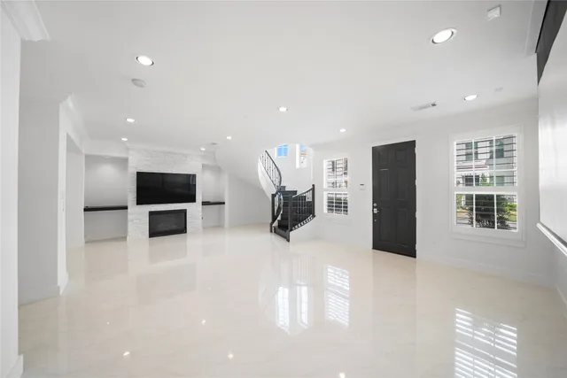a view of kitchen with furniture and a refrigerator