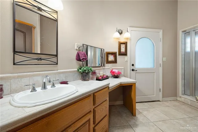 a bathroom with a sink and a mirror