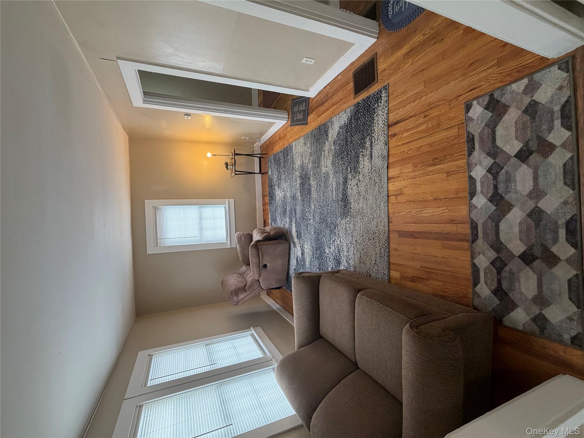 216 Old Rte 22 Wassaic, NY 12592 - Photo 2 of 11 a living room with a couch and a window