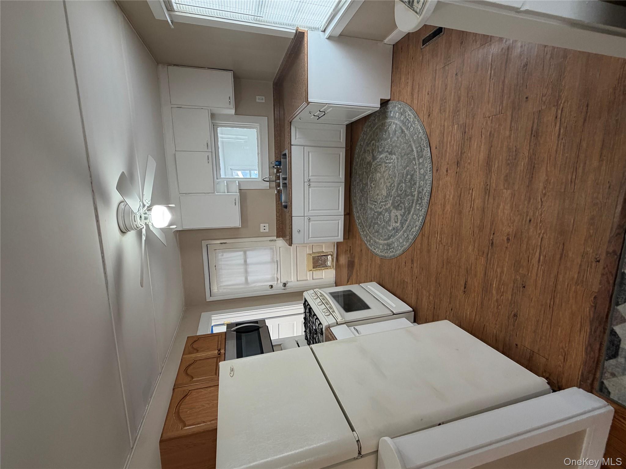 216 Old Rte 22 Wassaic, NY 12592 - Photo 3 of 11 a large kitchen with a sink stainless steel appliances and cabinets