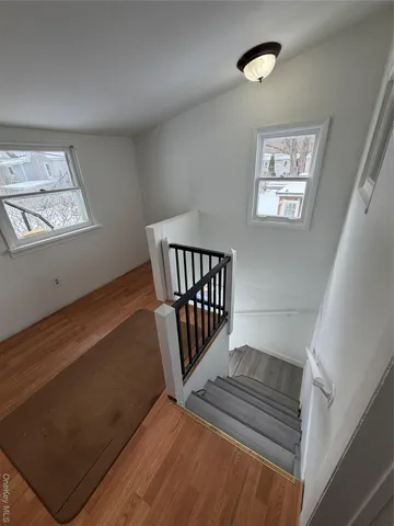 a view of a hallway with windows