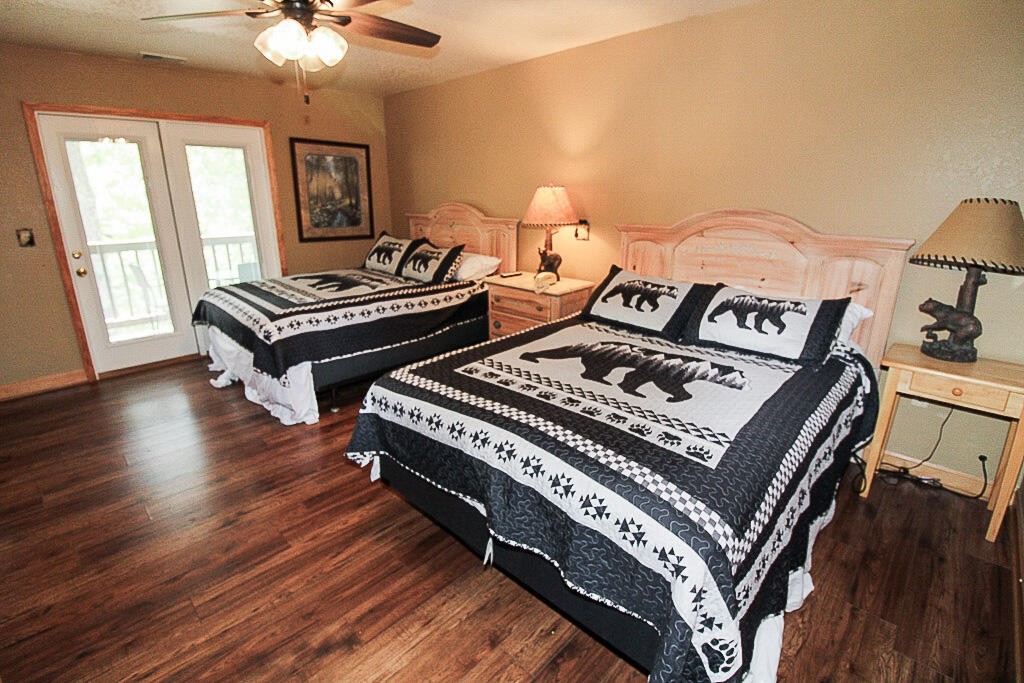 443 Loop Road Gatlinburg, TN 37738 - Photo 27 of 40 a view of bedroom with furniture and wooden floor