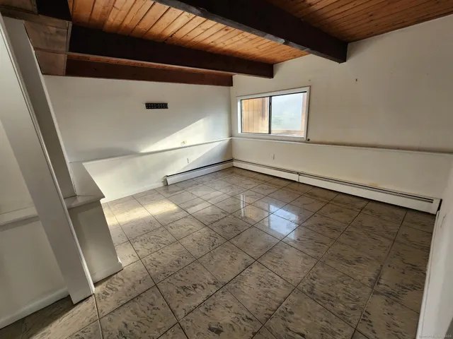 a kitchen with a stove and a refrigerator
