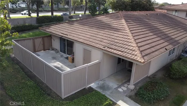 a roof deck with table and chairs