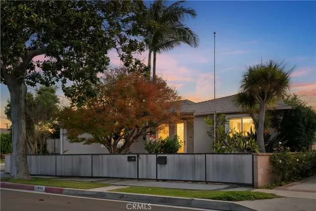 a large kitchen with a sink and cabinets