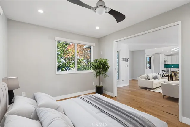 a bedroom with a large bed and a window