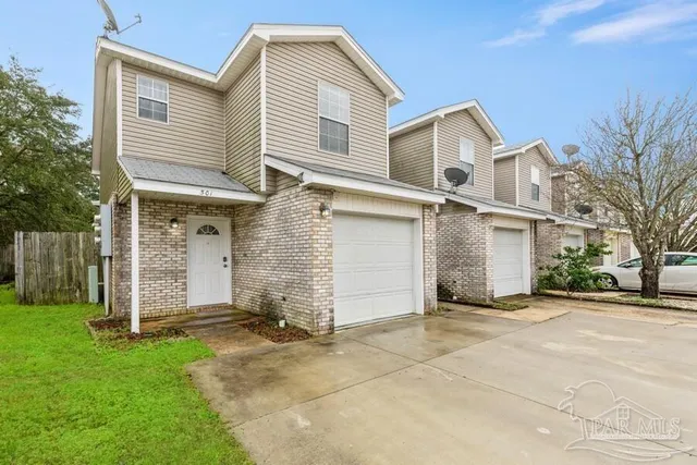 front view of a house with a yard