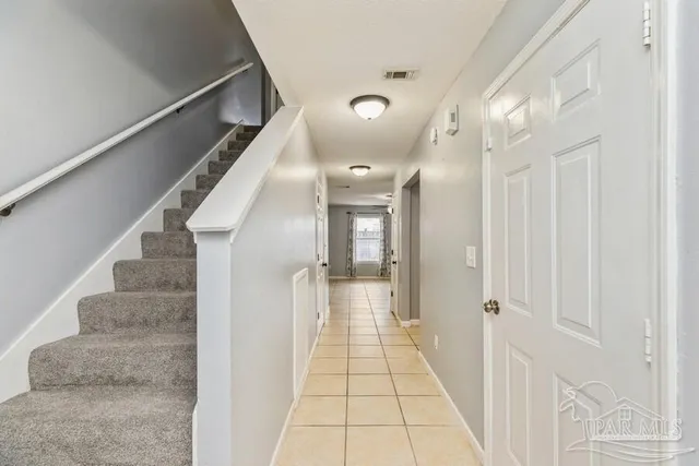 a view of a hallway with staircase