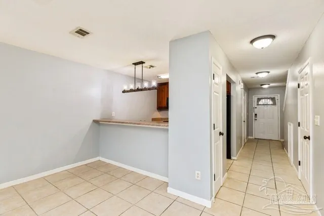 a view of a kitchen with a refrigerator and a stove